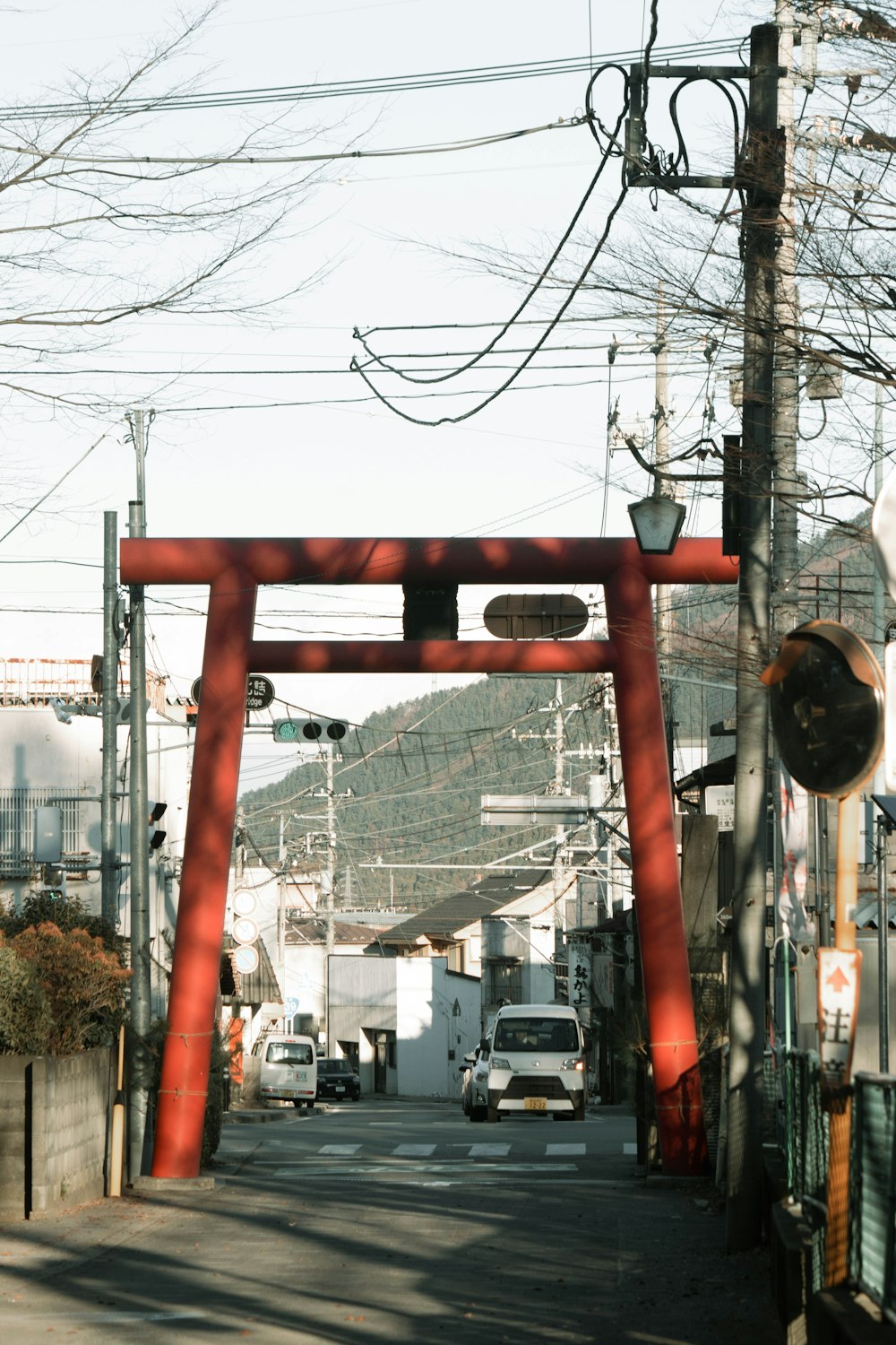 a large red arch in the middle of a street