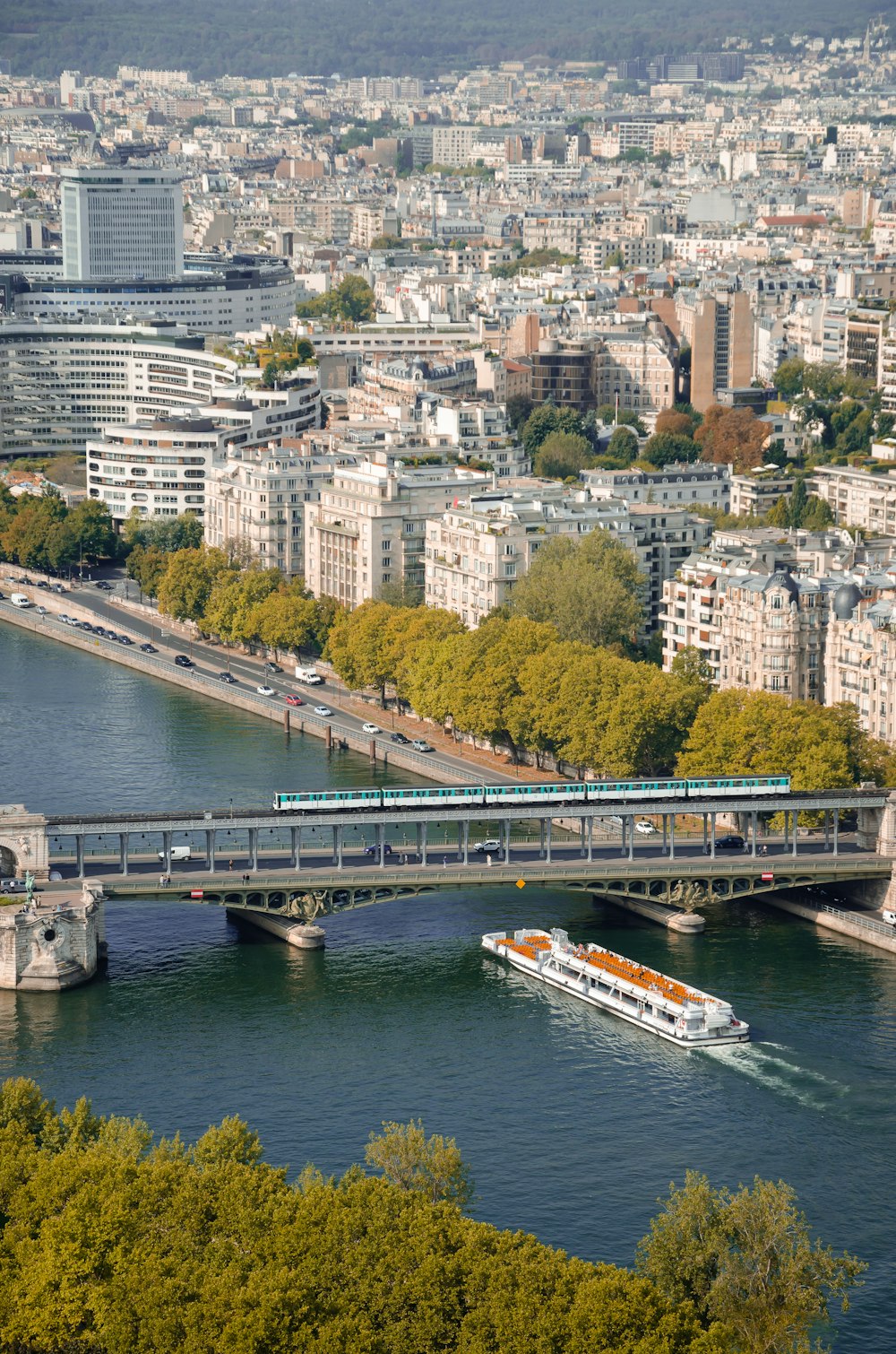 a bridge over a river with a boat on it