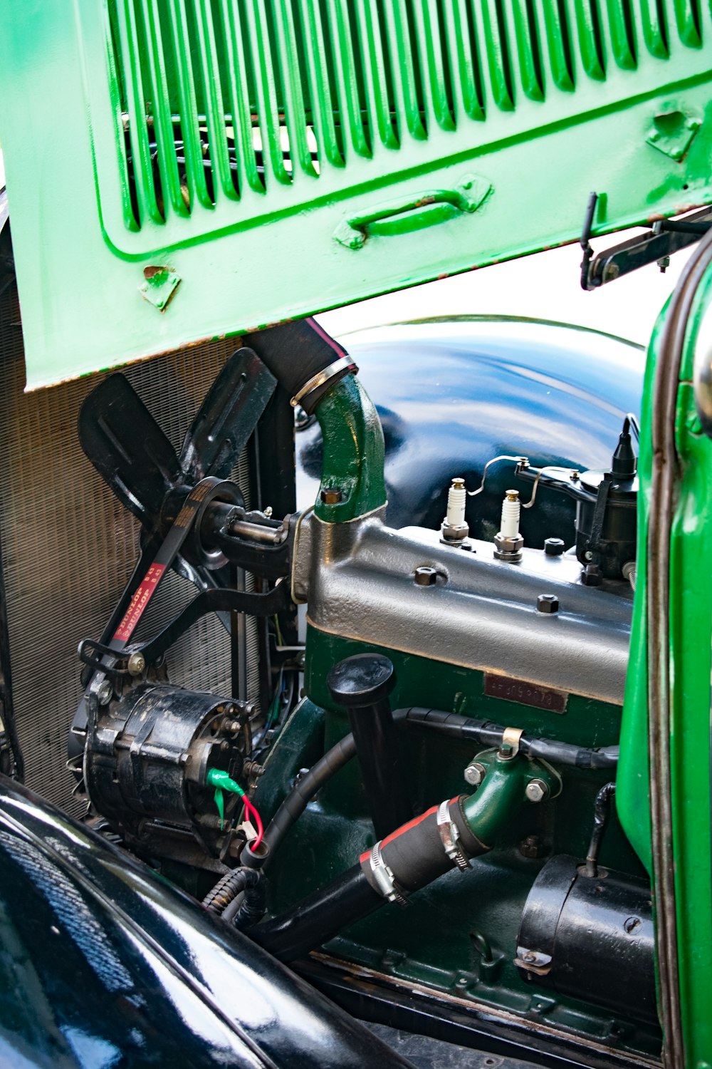 a close up of the engine of a green truck