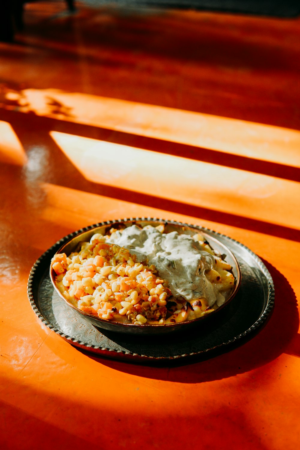 a bowl of macaroni and cheese on a table