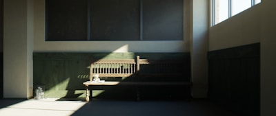 Rustic wooden bench placed in a cozy, sunlit room.