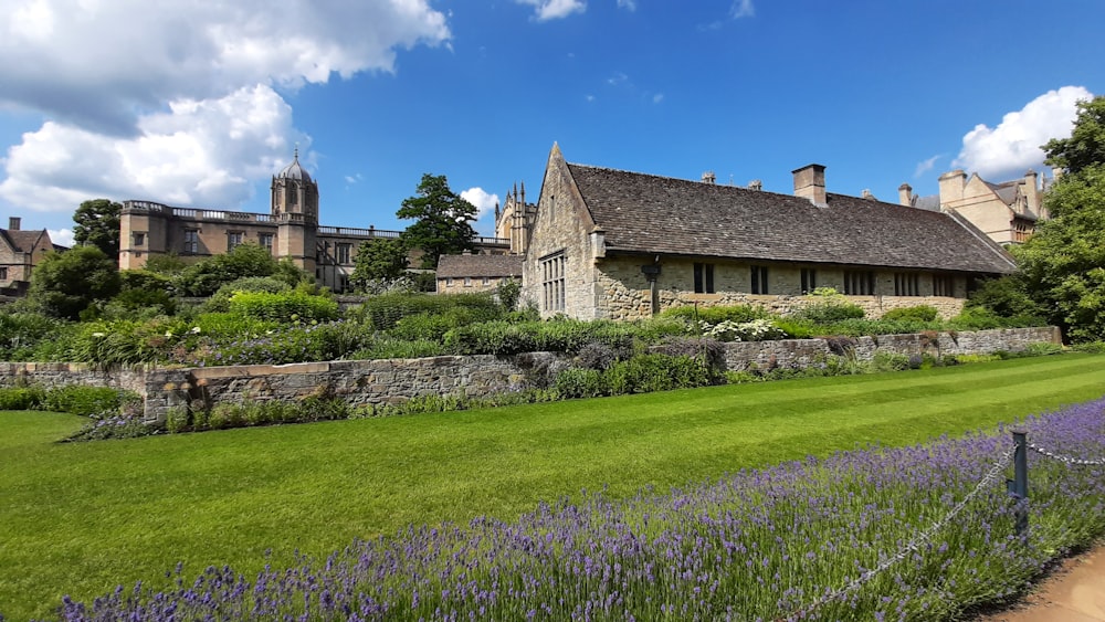 a large building with a garden in front of it