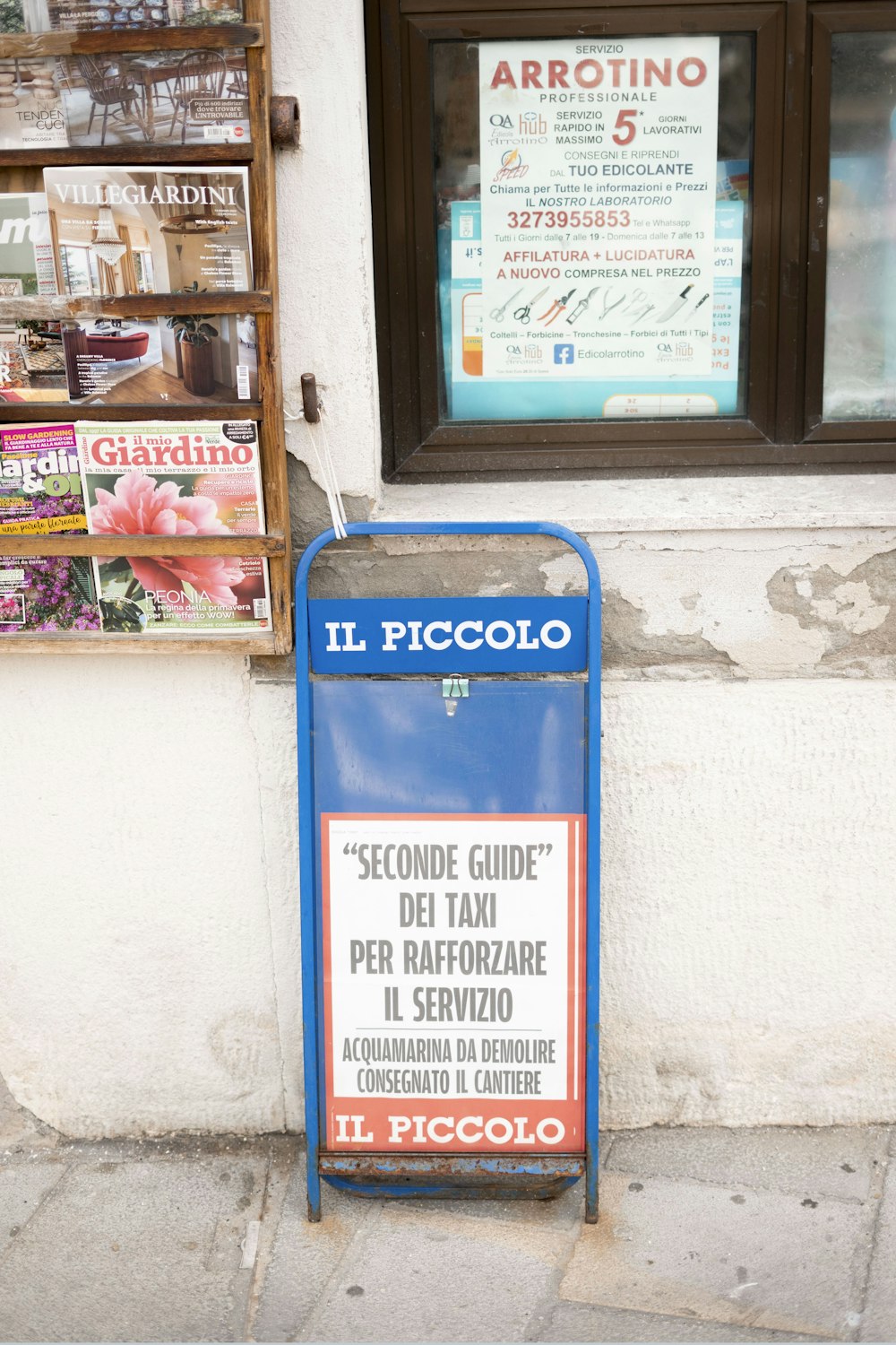 a sign on a sidewalk in front of a store