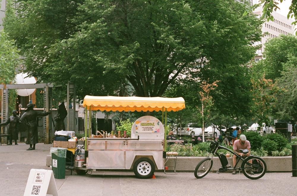 a food cart with a bike parked next to it