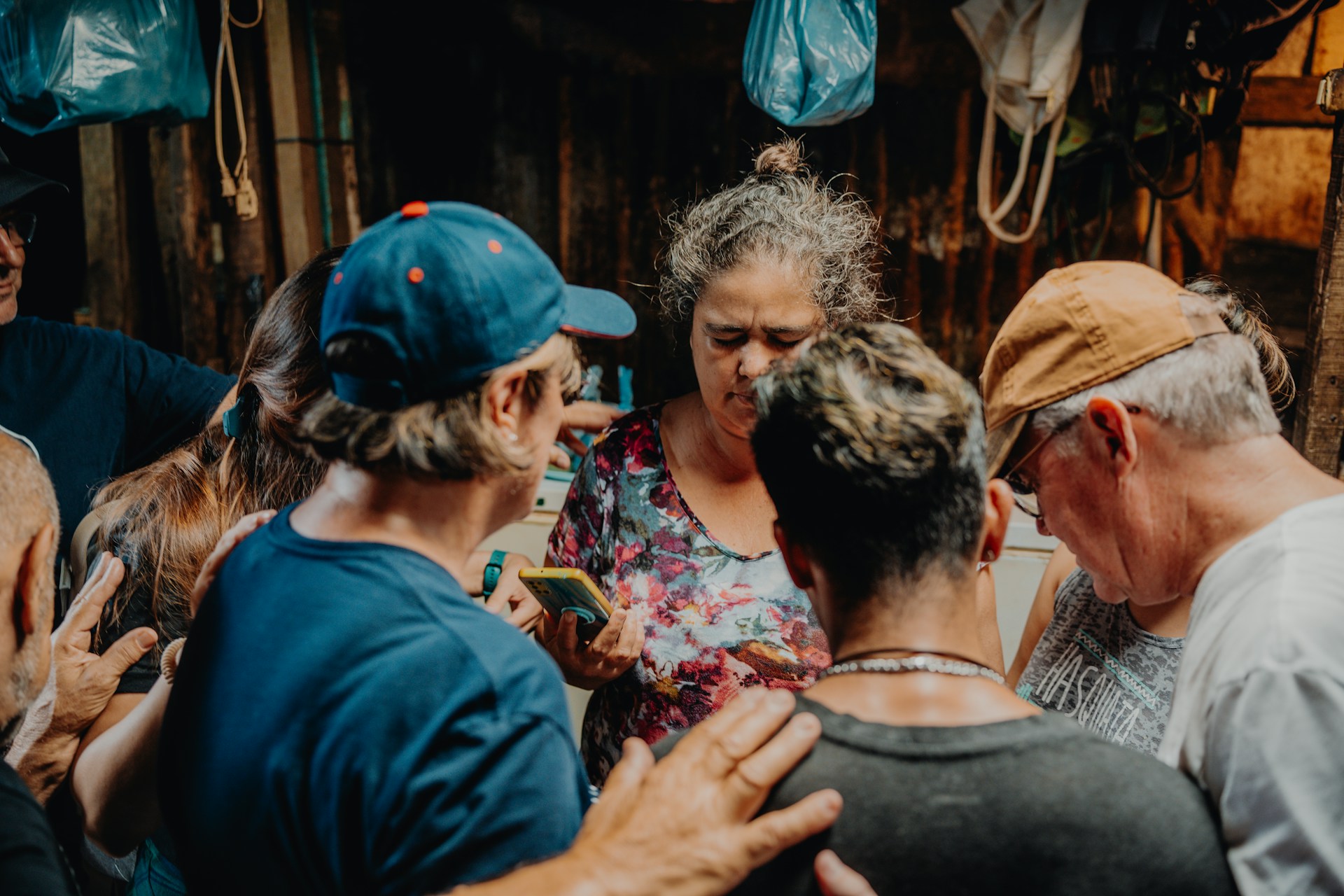 a group of people standing around each other