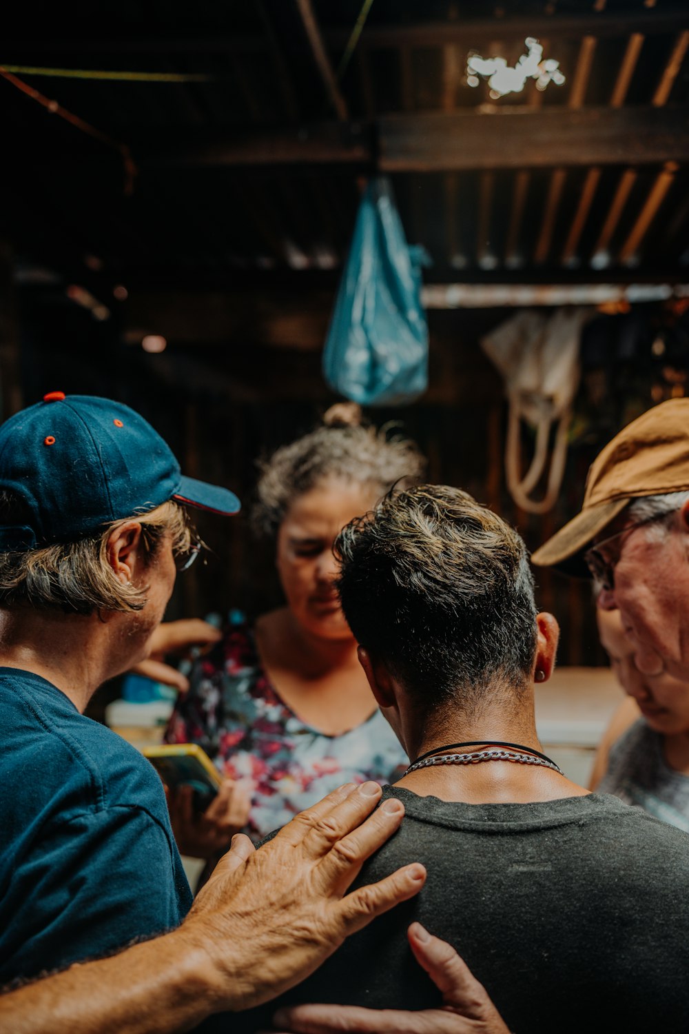 a group of people standing around each other