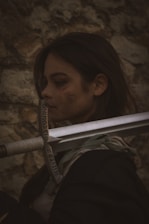 a woman with a sword in her hand