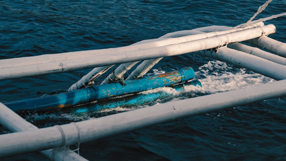 a pipe laying on top of a body of water