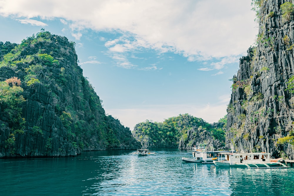 a group of boats floating on top of a river