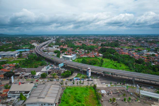 Aerial view of the land showcasing its proximity to a major highway and surrounding urban area.