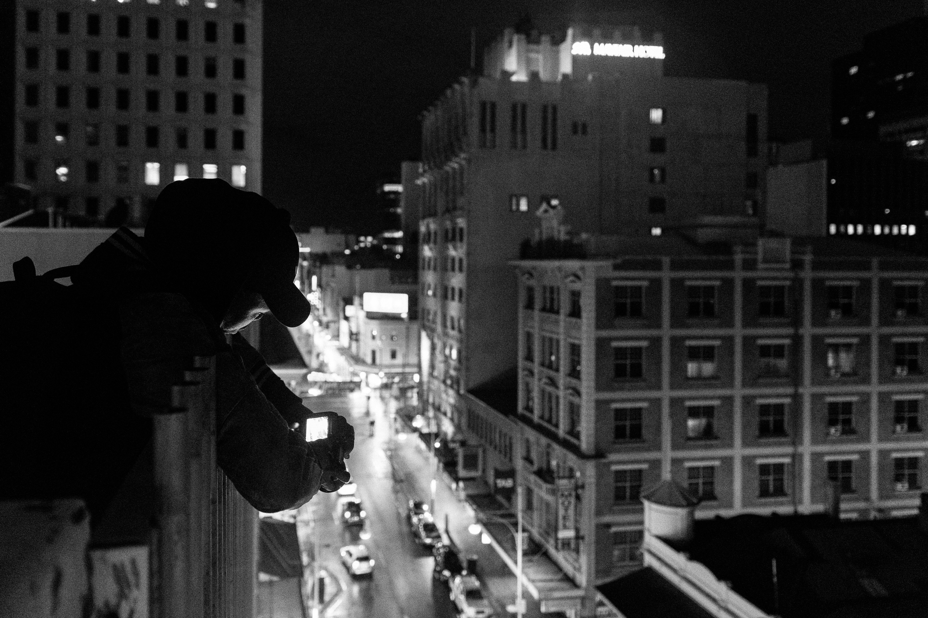 a black and white photo of a city at night