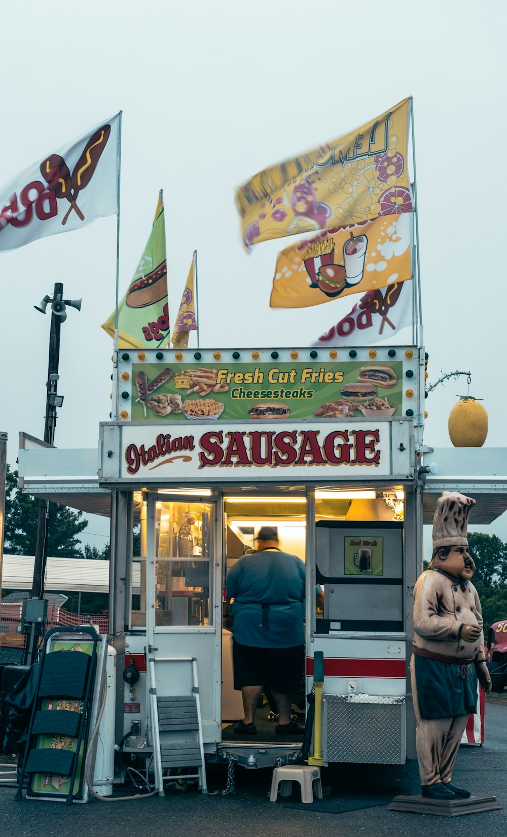 a person standing in front of a food truck