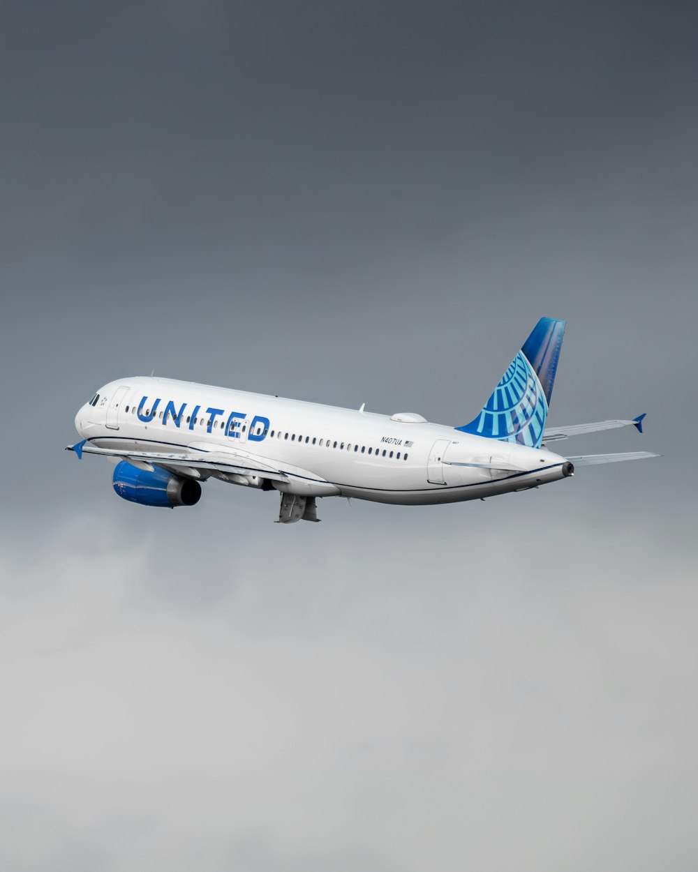 a united airlines plane flying in the sky
