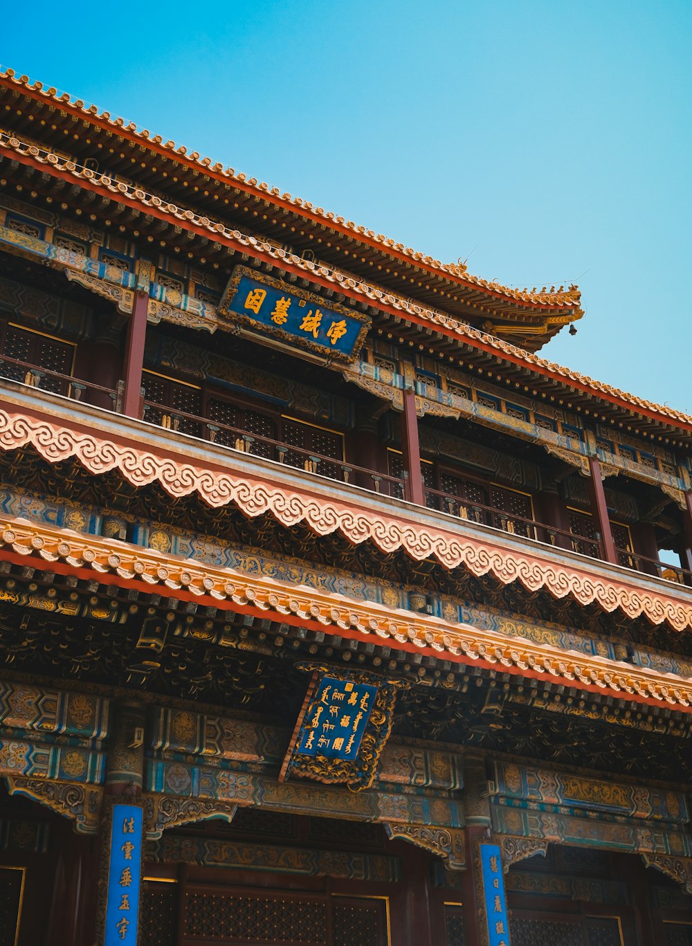 a tall building with a blue sky in the background