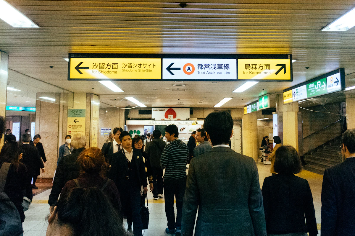 Passengers tapping IC cards at Tokyo station ticket gates