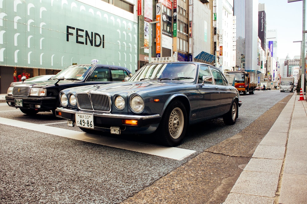 a couple of cars that are sitting in the street