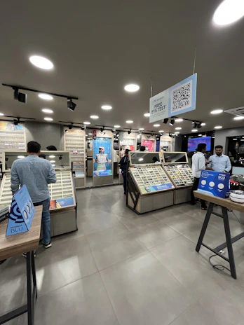 A modern optical store with AI-powered digital displays showing personalized eyewear recommendations.