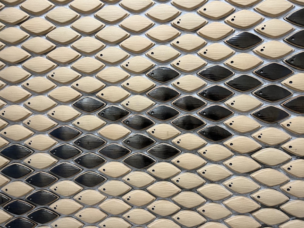 a close up of a metal surface with holes in it