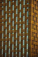 Modern building facade with subtle blue and gold technical line overlays