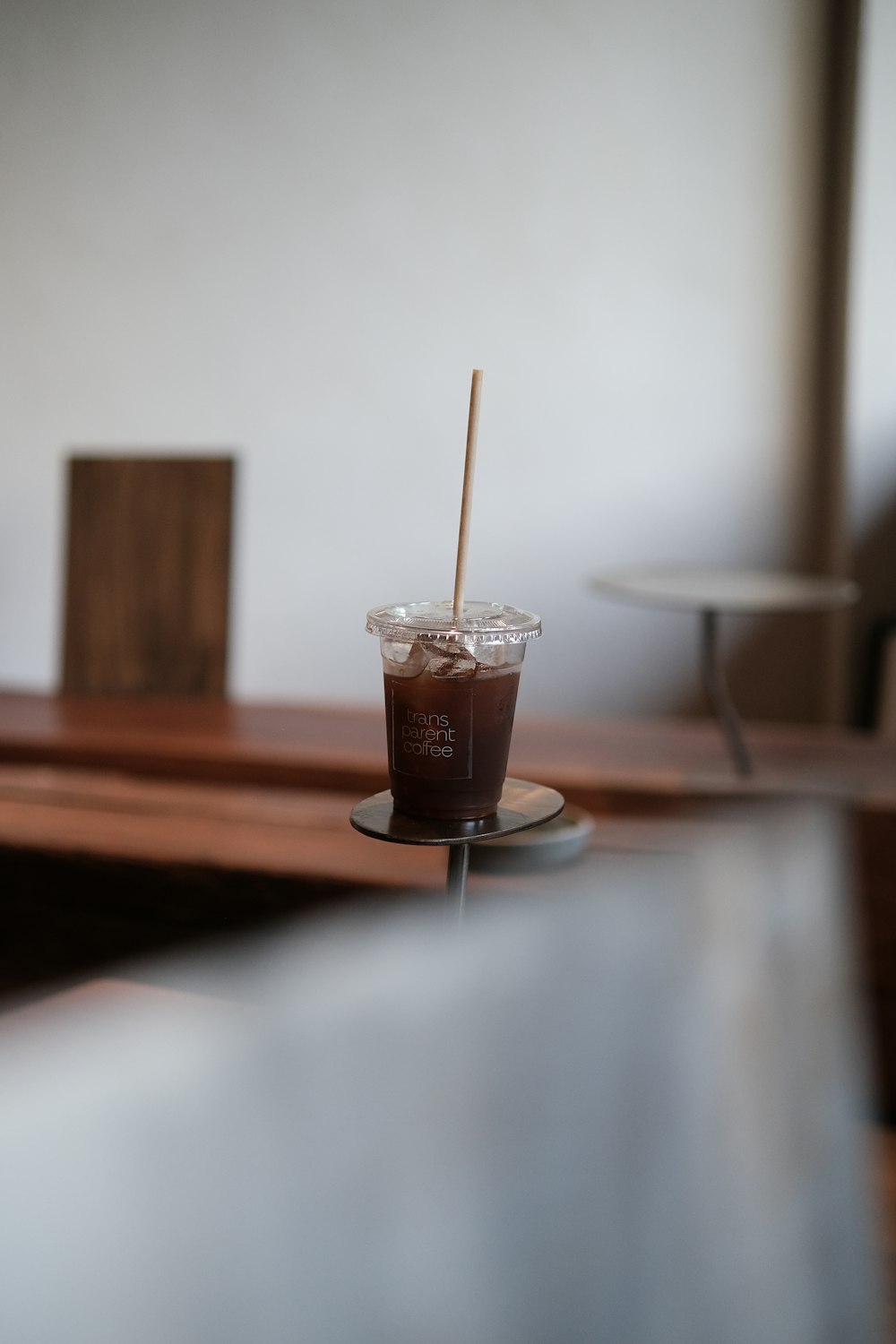 a cup with a straw in it sitting on a table