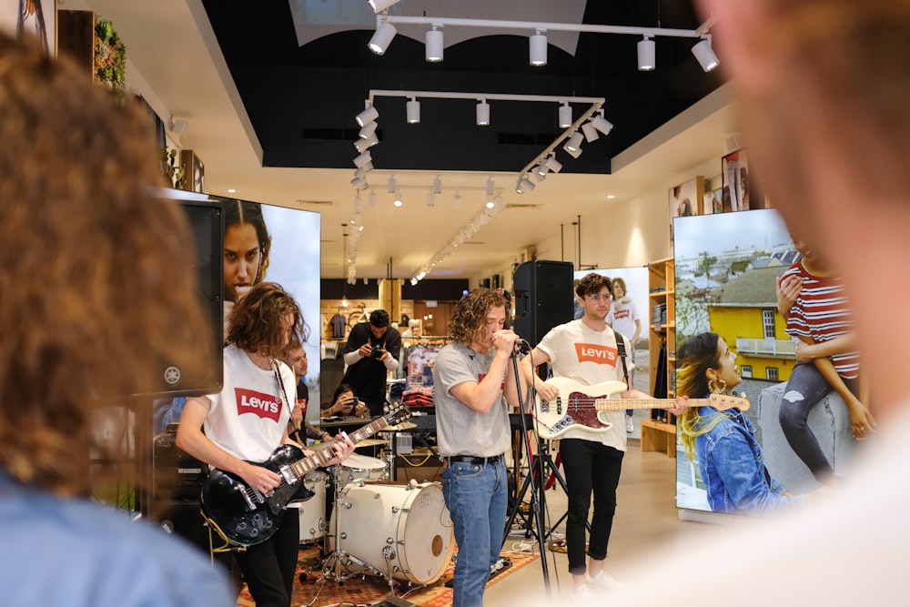 a group of people playing instruments in a room