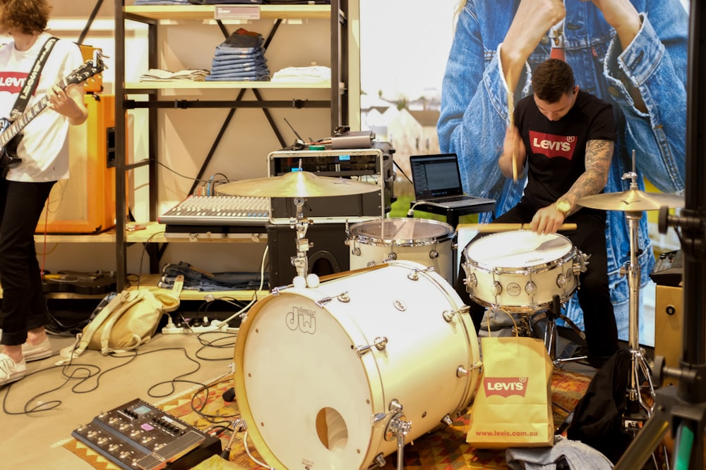 a group of people playing instruments in a room