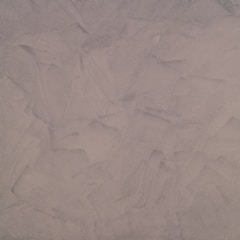 This texture features a uniform pattern of broad, sweeping brush strokes in shades of light taupe and beige. It has a rough, matte appearance resembling plaster or stucco.