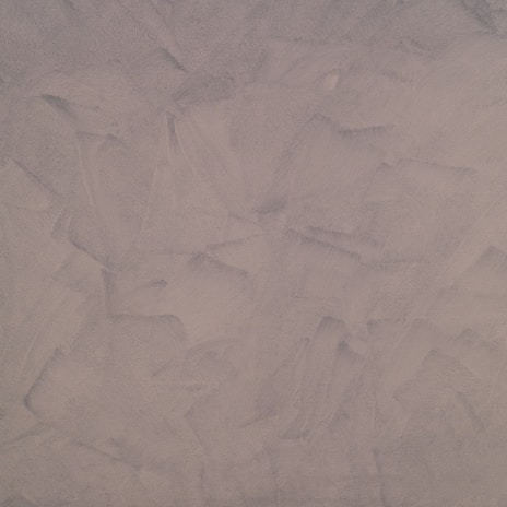 This texture features a uniform pattern of broad, sweeping brush strokes in shades of light taupe and beige. It has a rough, matte appearance resembling plaster or stucco.