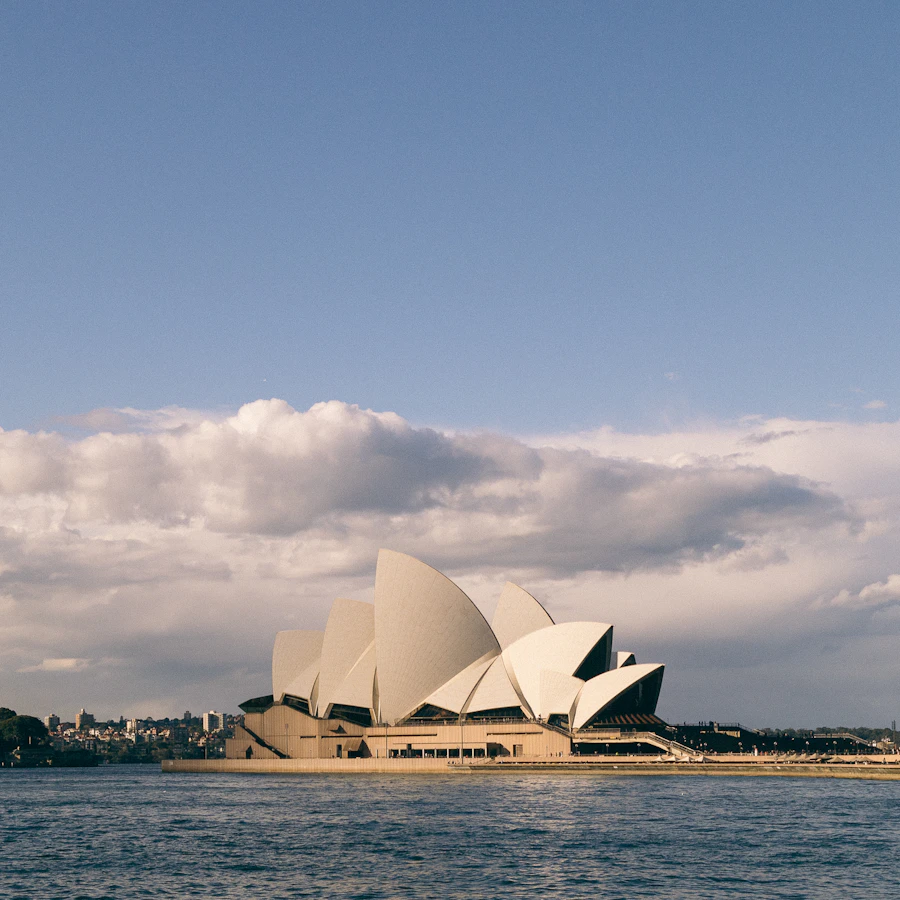 Sydney Opera House across the harbour at dusk