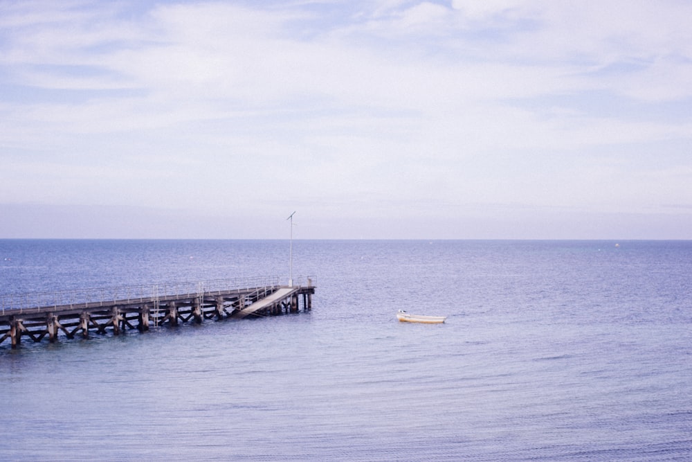 a long pier sitting on top of a large body of water