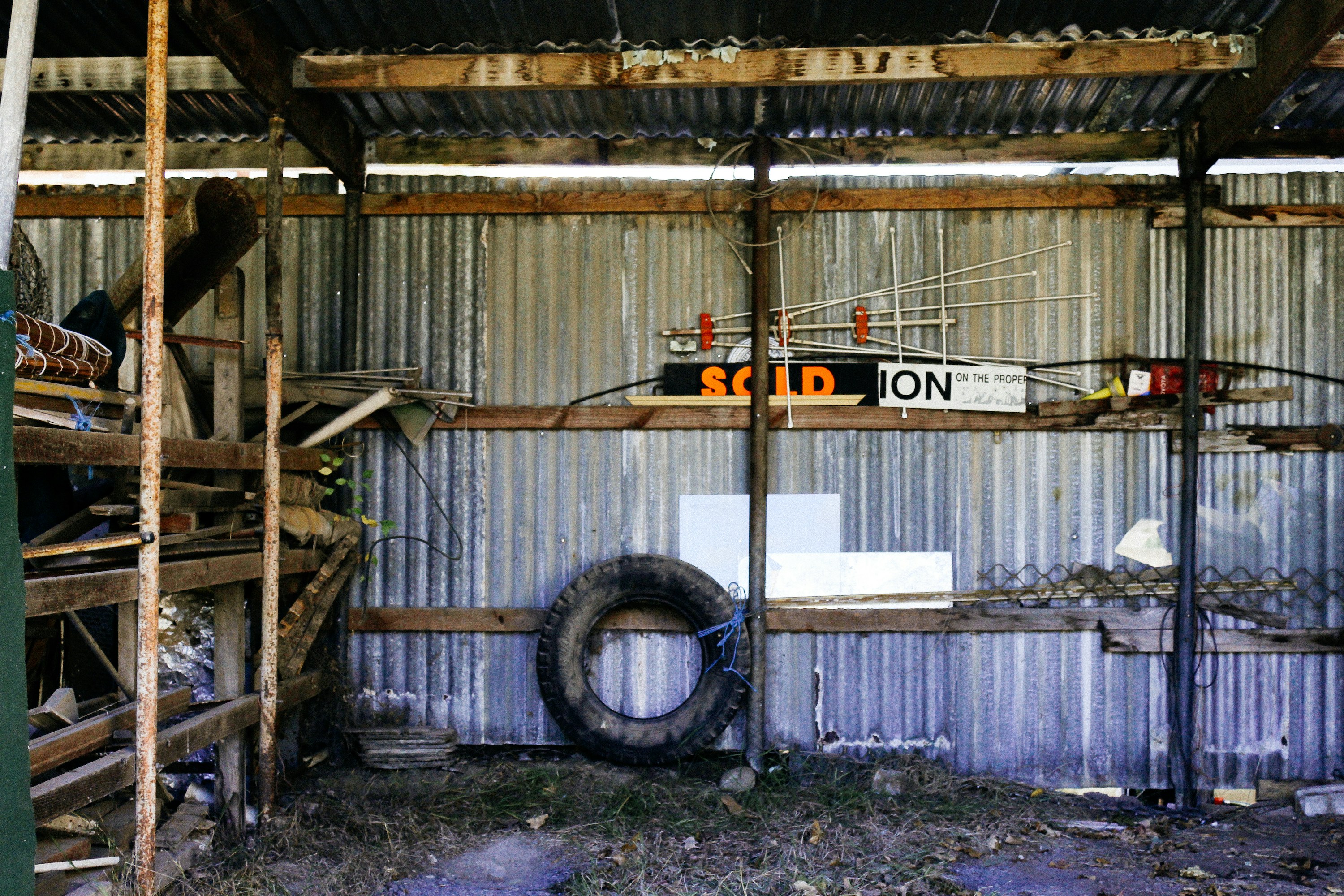 a building that has a tire and a sign on it