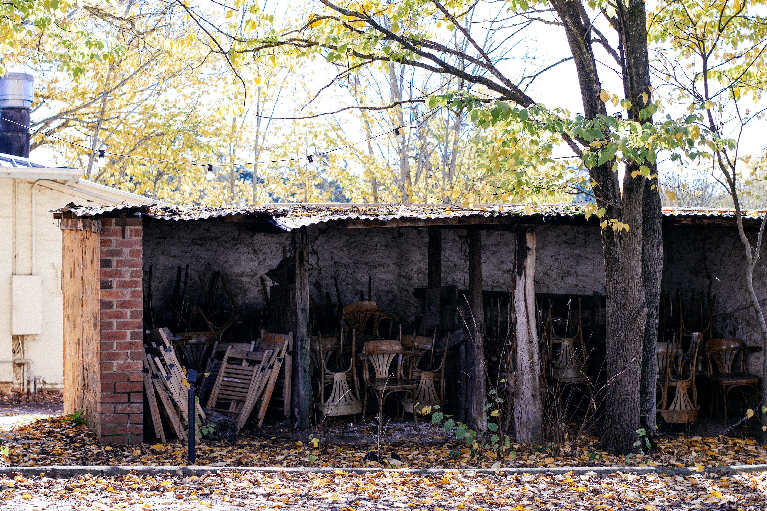 an old building with a bunch of junk in front of it