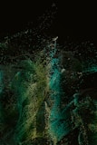 a black background with green and yellow speckles