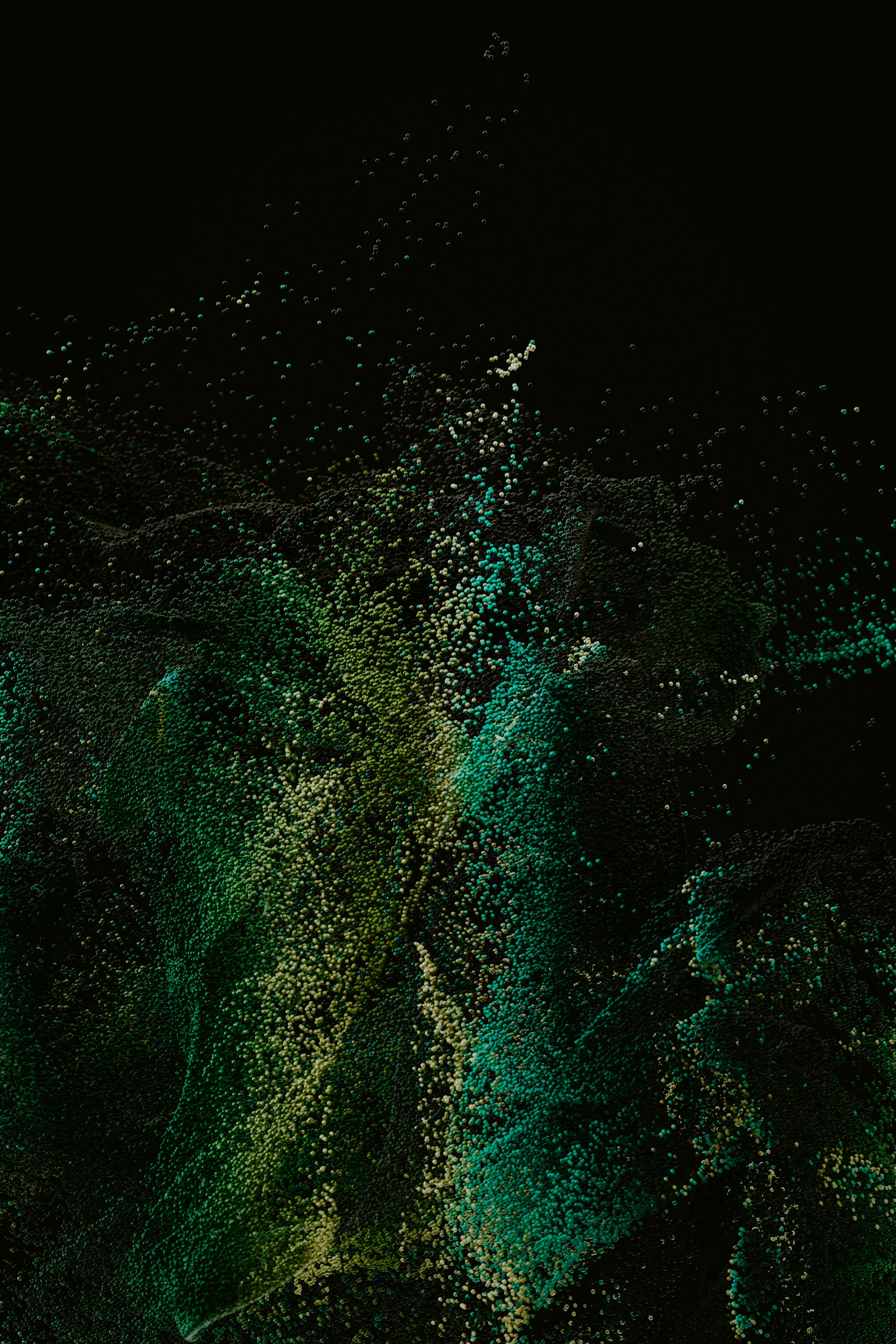 a black background with green and yellow speckles