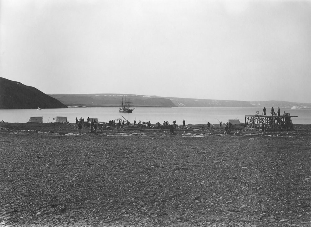 a black and white photo of a boat in the water