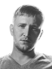 A professional portrait of Clint Vosloo.