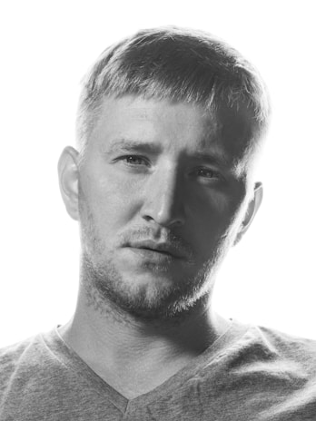 A professional portrait of Clint Vosloo.