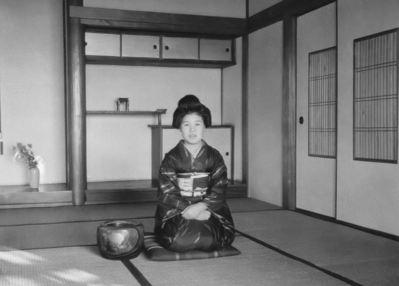 Japanese lady sitting on mat