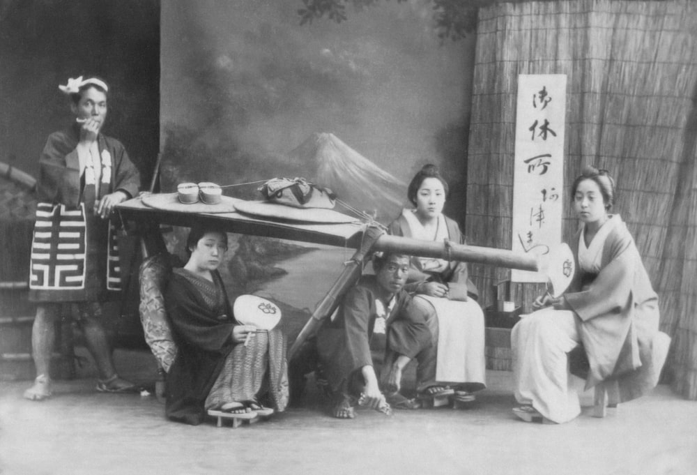 a group of asian women sitting around a table