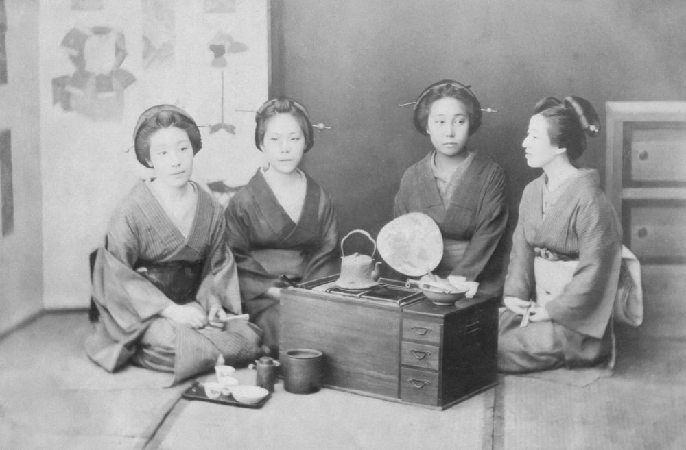 a group of women sitting next to each other