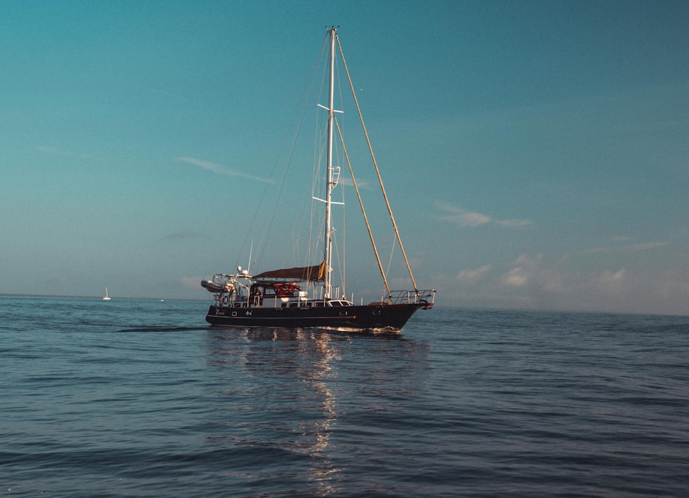 a sailboat in the middle of the ocean