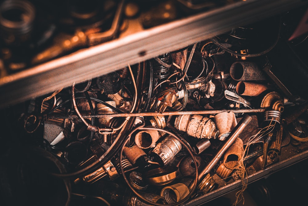 a box filled with lots of old metal items