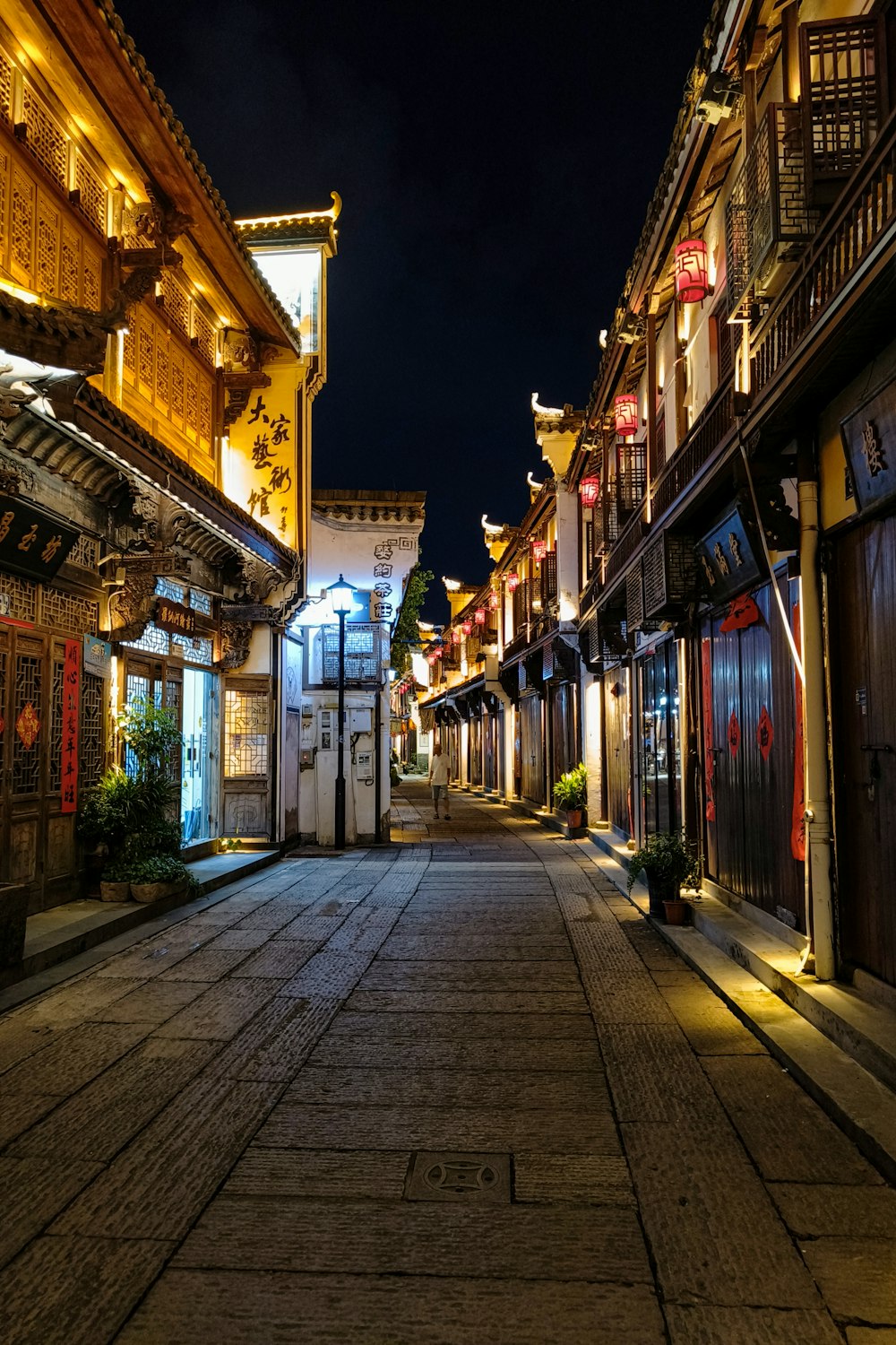 an empty street at night in a chinese town