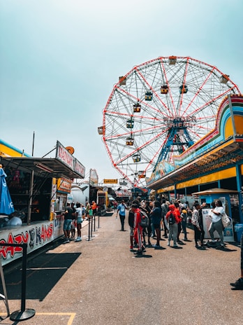 A vibrant carnival scene with families enjoying various activities.
