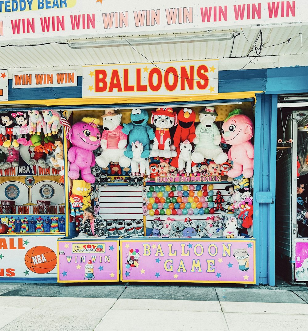 a store front with lots of stuffed animals on display