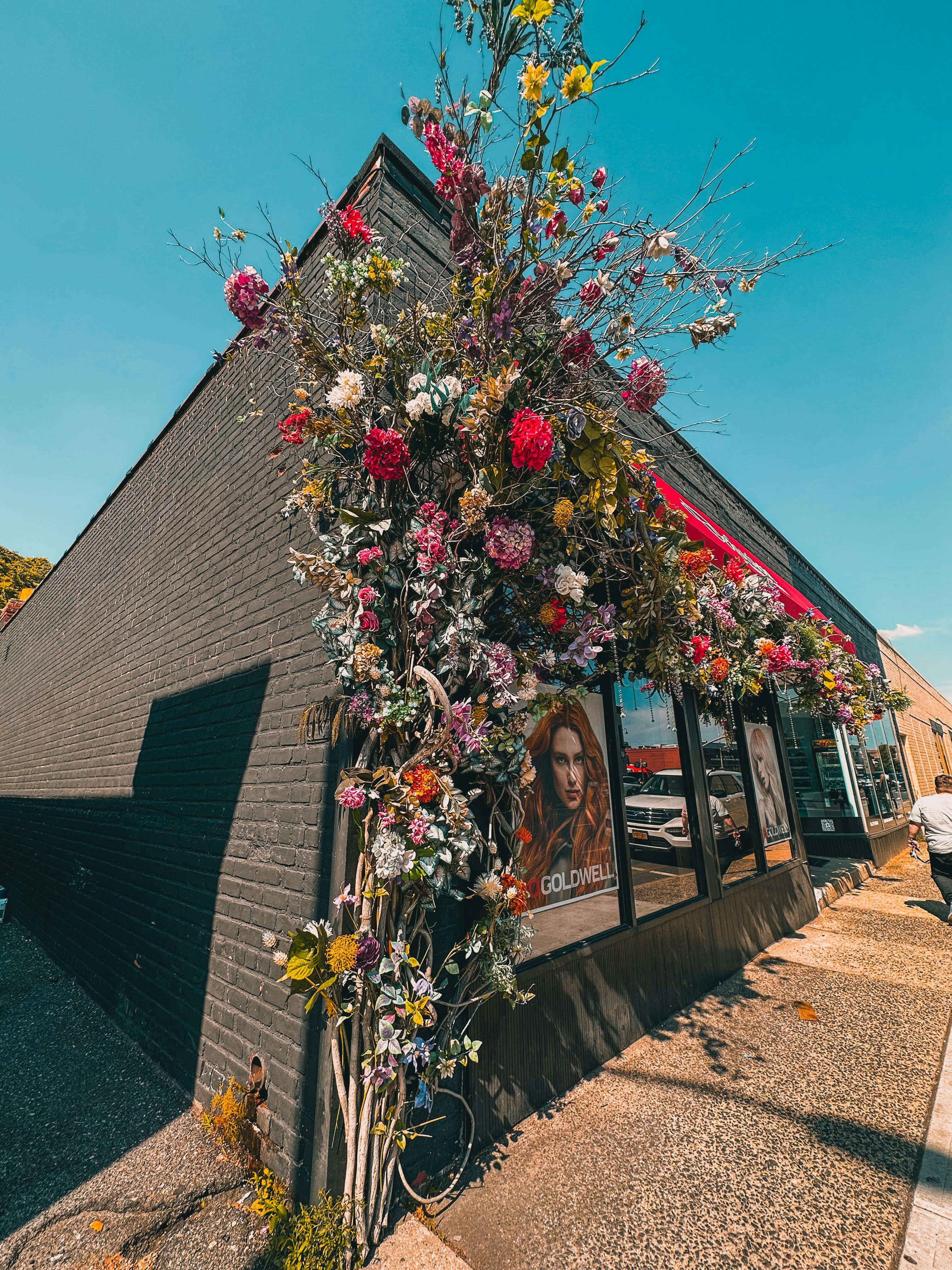 a building that has a bunch of flowers on it