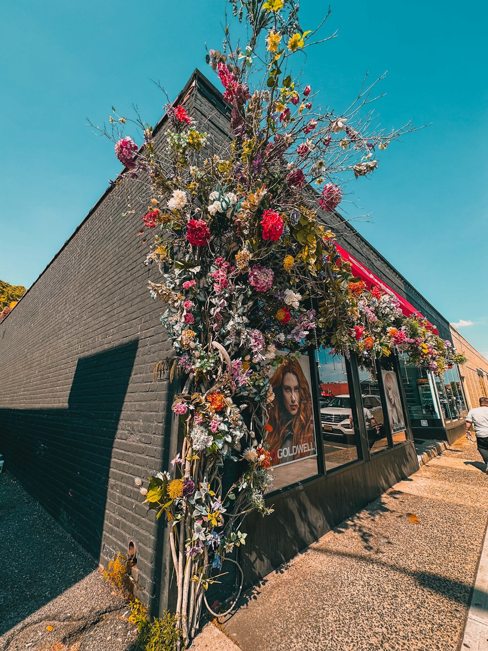 a building that has a bunch of flowers on it