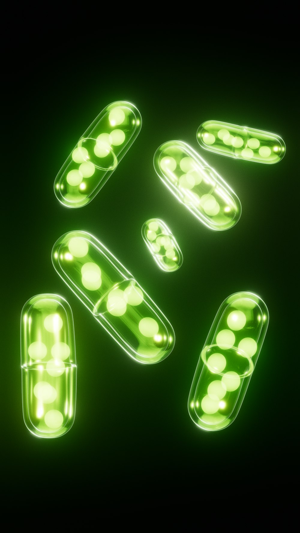 green pills are arranged on a black background