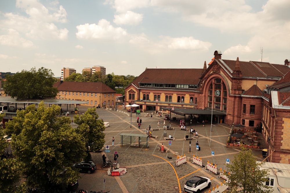 a group of people standing in front of a train station