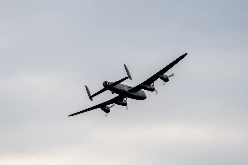 two planes flying in the sky on a cloudy day